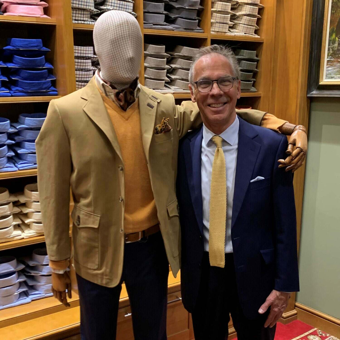A Cordings mannequin and Cordings sales associate standing side by side