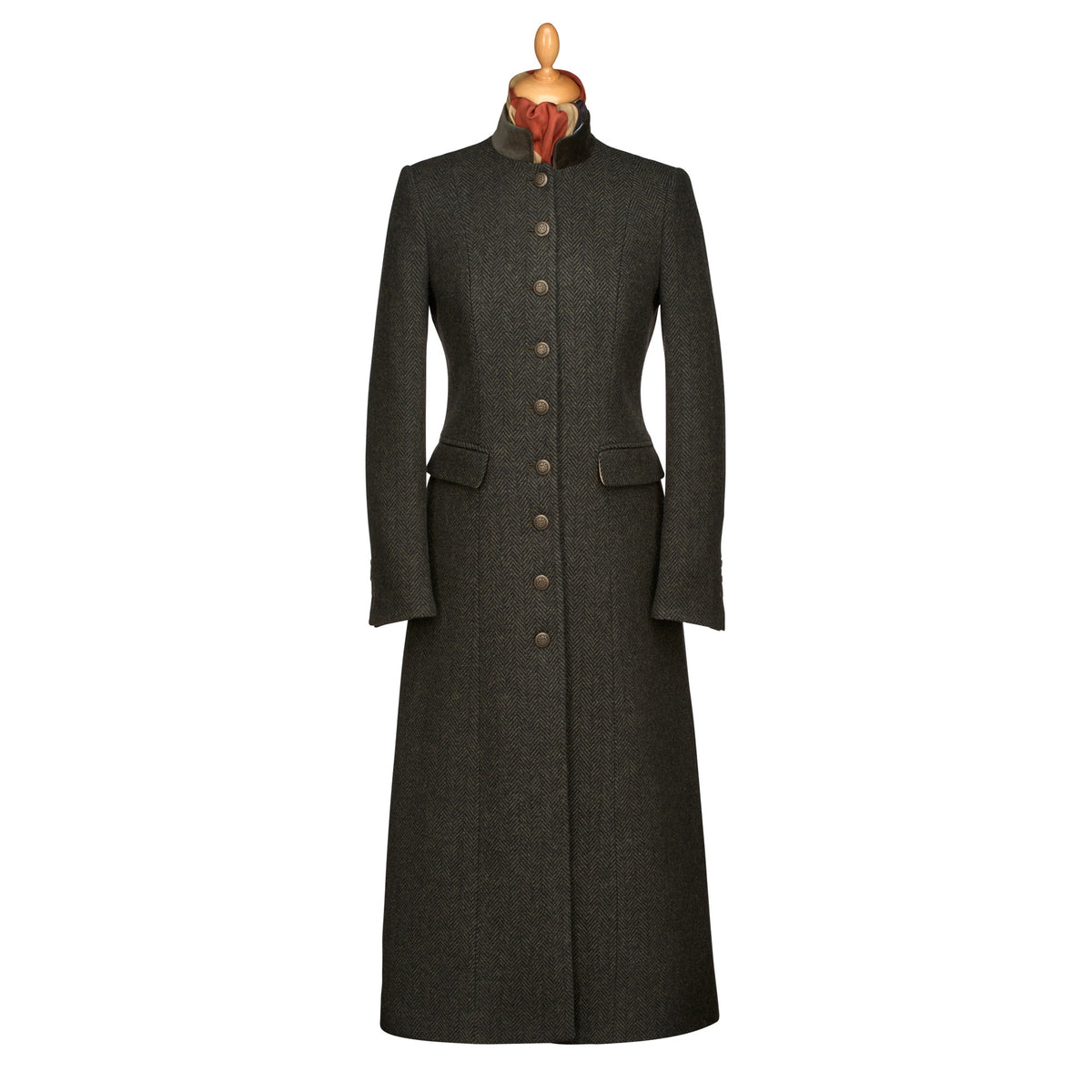 A long dark charcoal gray wool coat with a high stand collar, buttoned front, and flap pockets, displayed on a mannequin torso against a plain white background.