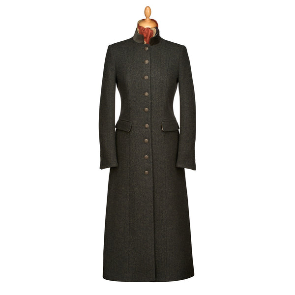 A long dark charcoal gray wool coat with a high stand collar, buttoned front, and flap pockets, displayed on a mannequin torso against a plain white background.